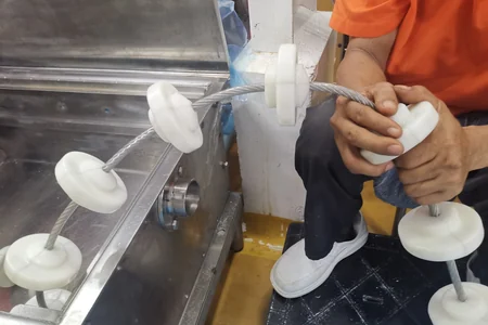 Cable and polymer disc assembly